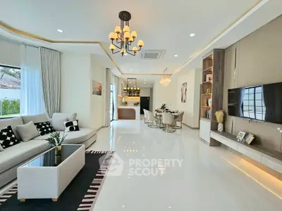 Spacious modern living room with elegant decor and open kitchen layout