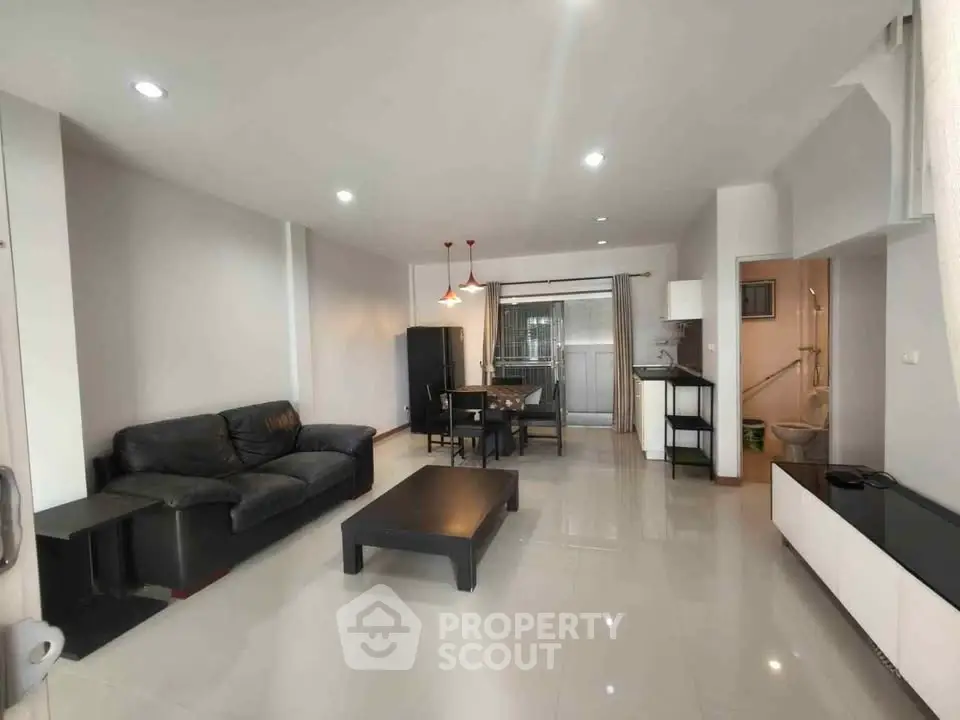 Spacious modern living room with sleek furniture and open layout