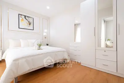 Elegant bedroom with modern white furniture and cozy decor