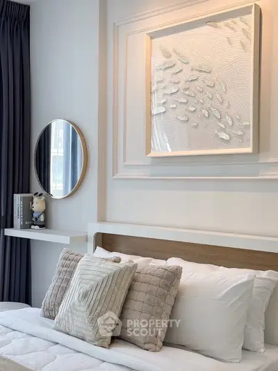 Stylish modern bedroom with elegant decor and plush pillows