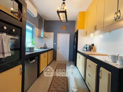 Modern kitchen with sleek appliances and stylish cabinetry