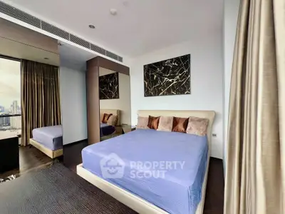 Luxurious bedroom with city view, elegant decor, and modern furnishings in high-rise apartment.