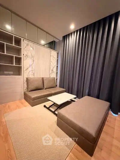 Modern living room with stylish furniture and elegant curtains in a cozy apartment.