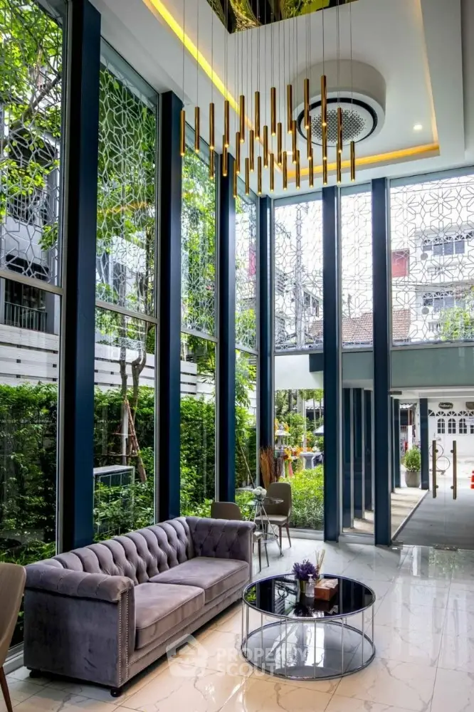 Luxurious modern lobby with high ceilings and elegant chandelier