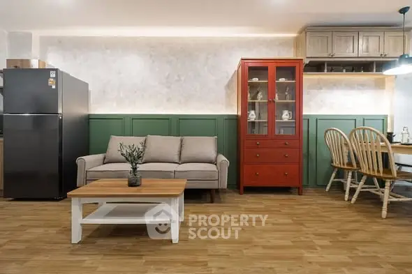 Charming living room with modern furniture and cozy dining area, perfect for family gatherings.