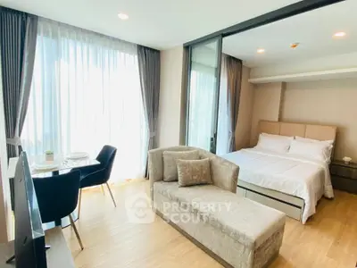 Modern studio apartment with elegant decor and natural light