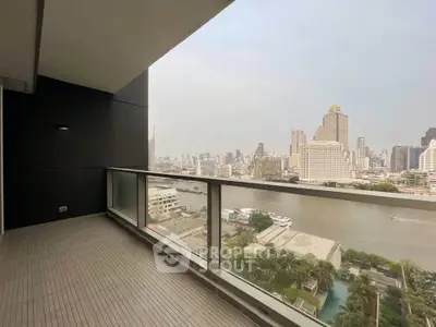 Spacious balcony with stunning city and river view, perfect for relaxation and entertainment.