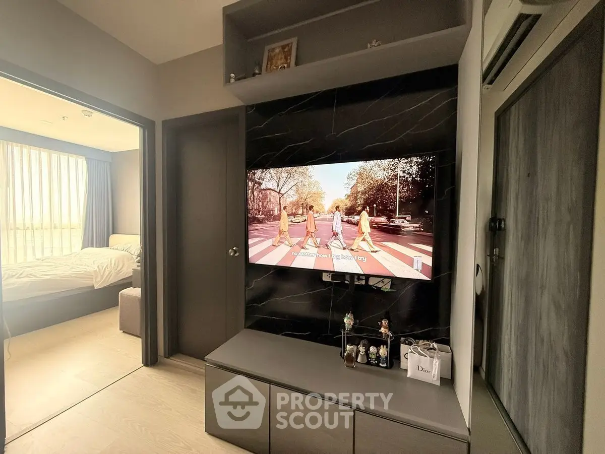 Modern living room with TV and bedroom view, stylish interior design