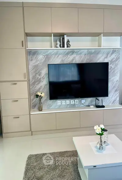 Modern living room with sleek TV unit and elegant decor
