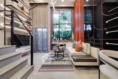 Modern living room with stylish decor, large windows, and a cozy seating area, perfect for relaxation and entertainment.