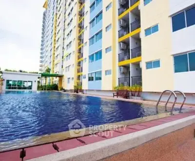 Modern apartment building with inviting outdoor pool and sun deck.