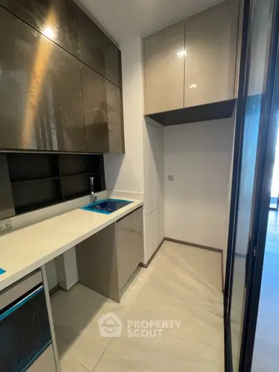 Modern kitchen with sleek cabinetry and compact layout, perfect for urban living.