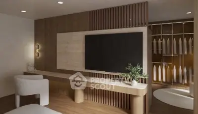 Modern living room with sleek wooden decor and large TV, featuring a stylish walk-in closet.