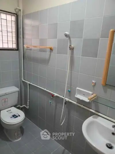 Functional bathroom with shower and toilet in modern apartment