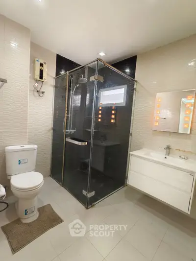 Modern bathroom with glass shower and sleek fixtures