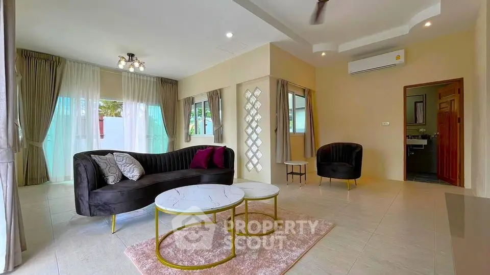 Spacious modern living room with elegant furniture and natural light