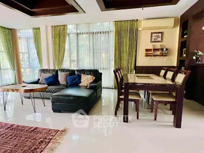 Spacious living room with elegant dining area and modern decor