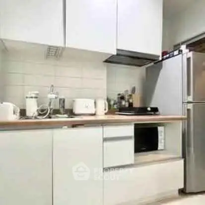 Modern kitchen with sleek cabinetry and stainless steel appliances