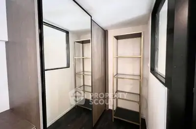 Modern storage room with sleek shelving and mirrored doors
