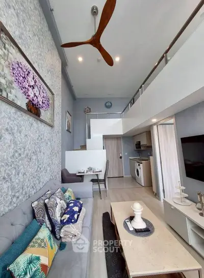 Modern loft-style living room with high ceilings and stylish decor