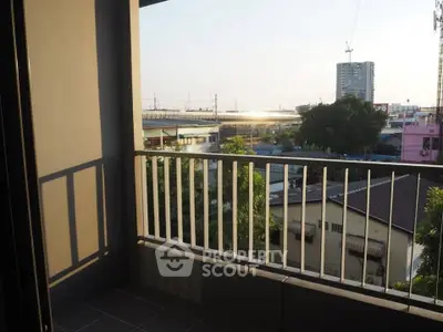 Charming balcony with city view, perfect for relaxing and enjoying the urban skyline.