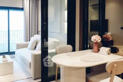 Modern living room with elegant dining area and balcony view