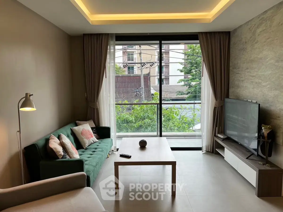 Modern living room with large window and stylish decor