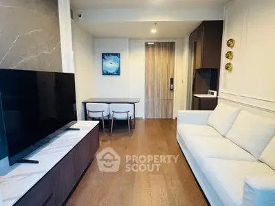 Modern living room with sleek furniture and stylish decor in a contemporary apartment.