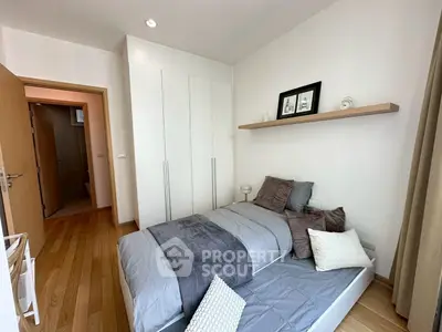Cozy modern bedroom with wooden flooring and minimalist decor