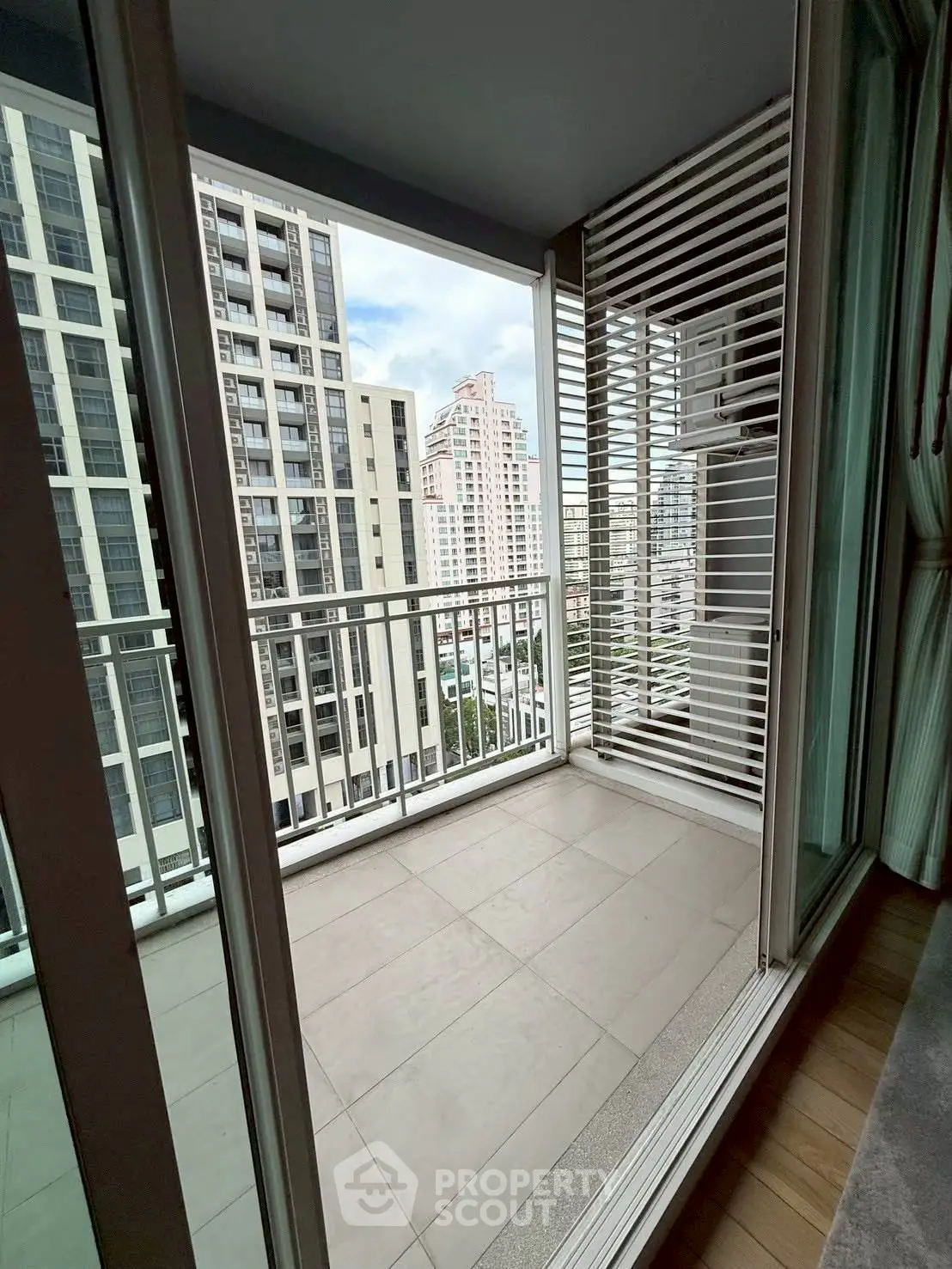 Modern balcony with city view in high-rise apartment