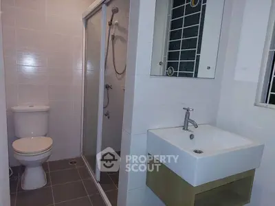 Modern bathroom with shower and sleek sink design