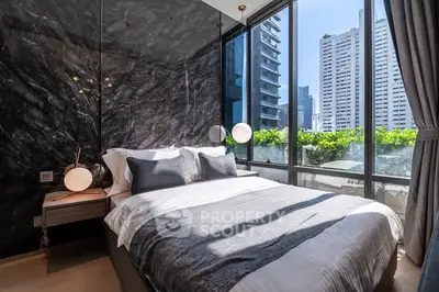 Luxurious bedroom with modern decor and stunning city view through large windows.