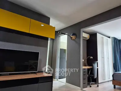 Modern apartment interior with sleek TV unit and workspace