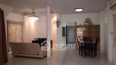 Spacious living room with elegant dining area and modern decor