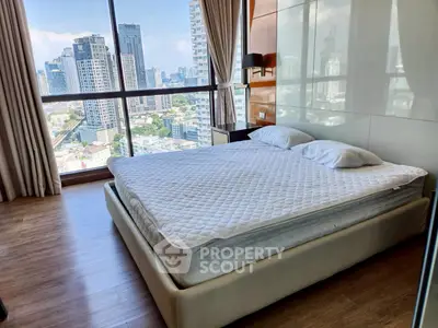Luxurious bedroom with stunning city view and modern decor