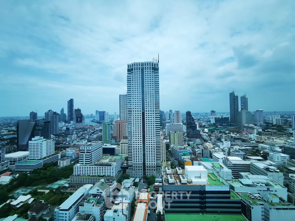 Stunning cityscape view showcasing modern skyscrapers and urban landscape under a clear blue sky.