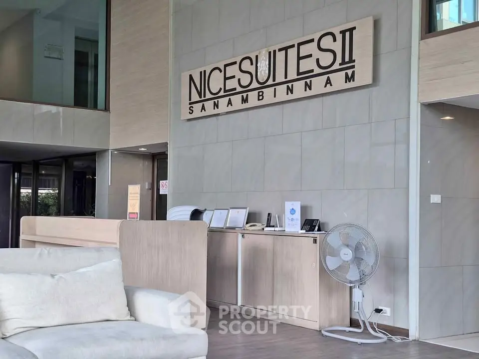 Modern lobby area with stylish decor at Nice Suites II Sanambinnam, featuring comfortable seating and sleek design.