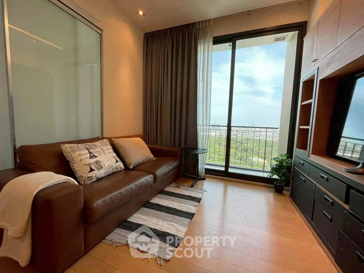 Modern living room with large window and scenic view
