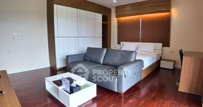 Modern bedroom with sleek design and hardwood floors