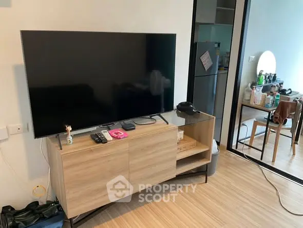Modern living room with sleek TV setup and stylish wooden cabinet