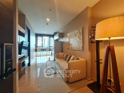 Modern living room with cozy sofa and stylish floor lamp in elegant apartment