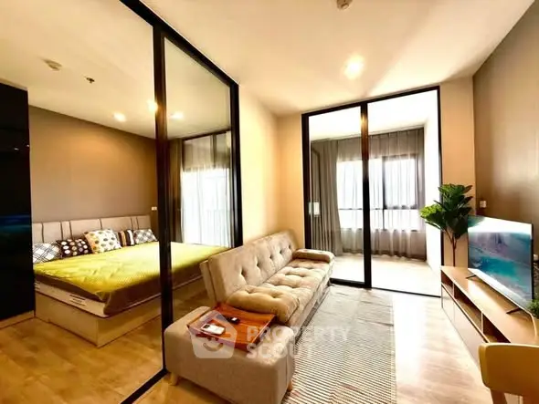 Modern living room with glass partition and cozy bedroom view