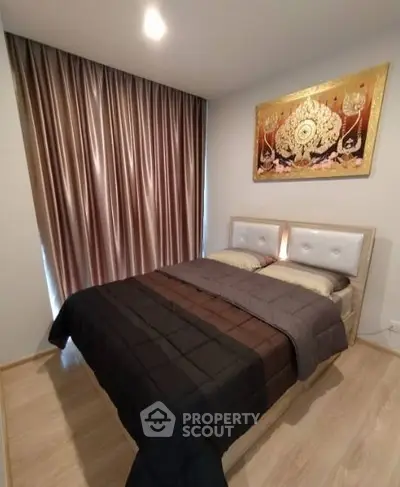 Cozy bedroom with elegant decor and soft lighting, perfect for relaxation.