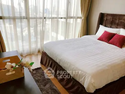 Luxurious bedroom with city view and elegant decor