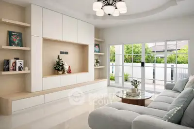 Spacious modern living room with elegant decor and large windows opening to a garden view.