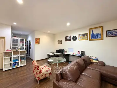 Spacious living room with modern decor and comfortable seating