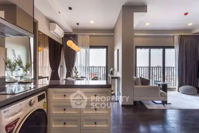 Modern open-plan living room with kitchen and balcony view in luxury apartment