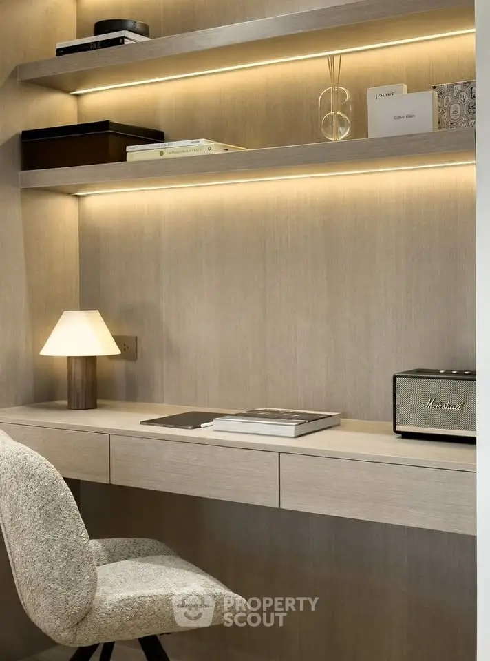 Modern study nook with built-in desk and shelves, featuring ambient lighting and stylish decor.