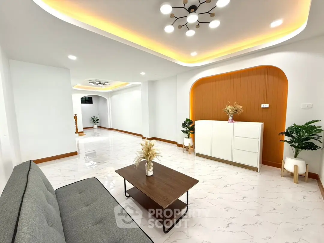 Spacious modern living room with elegant lighting and stylish decor