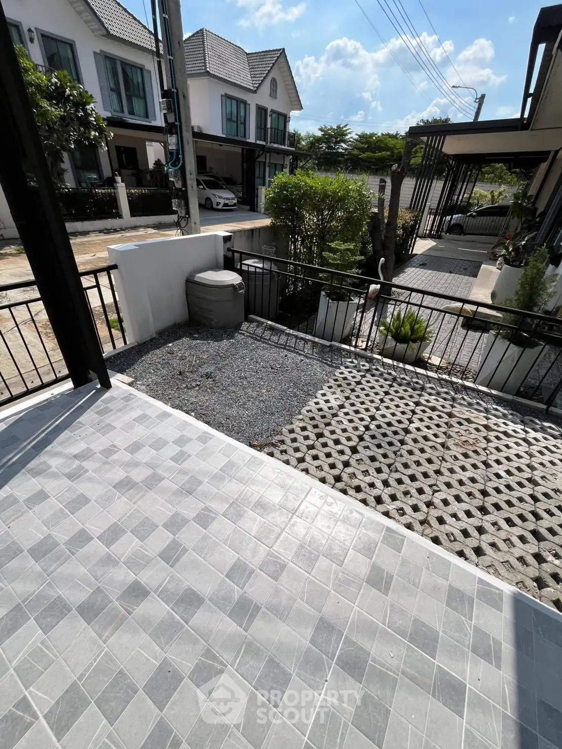 Charming townhouse exterior with modern design and spacious driveway